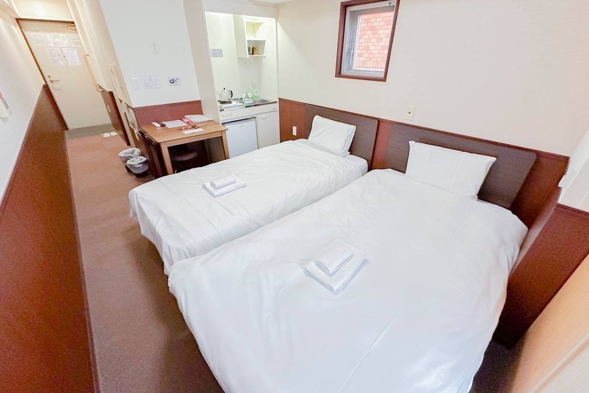 Twin beds in a high-floor room