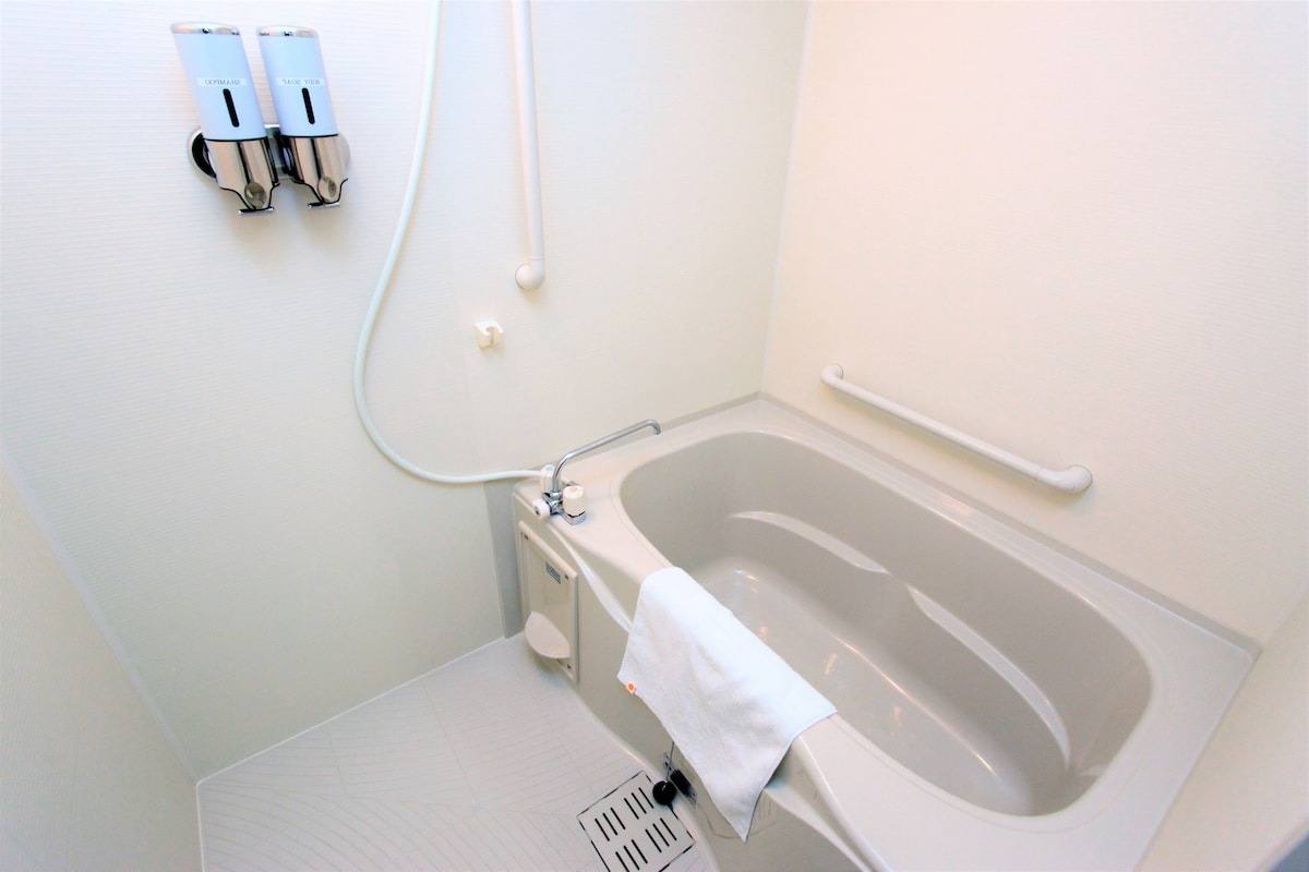 Bathroom with a full-size tub