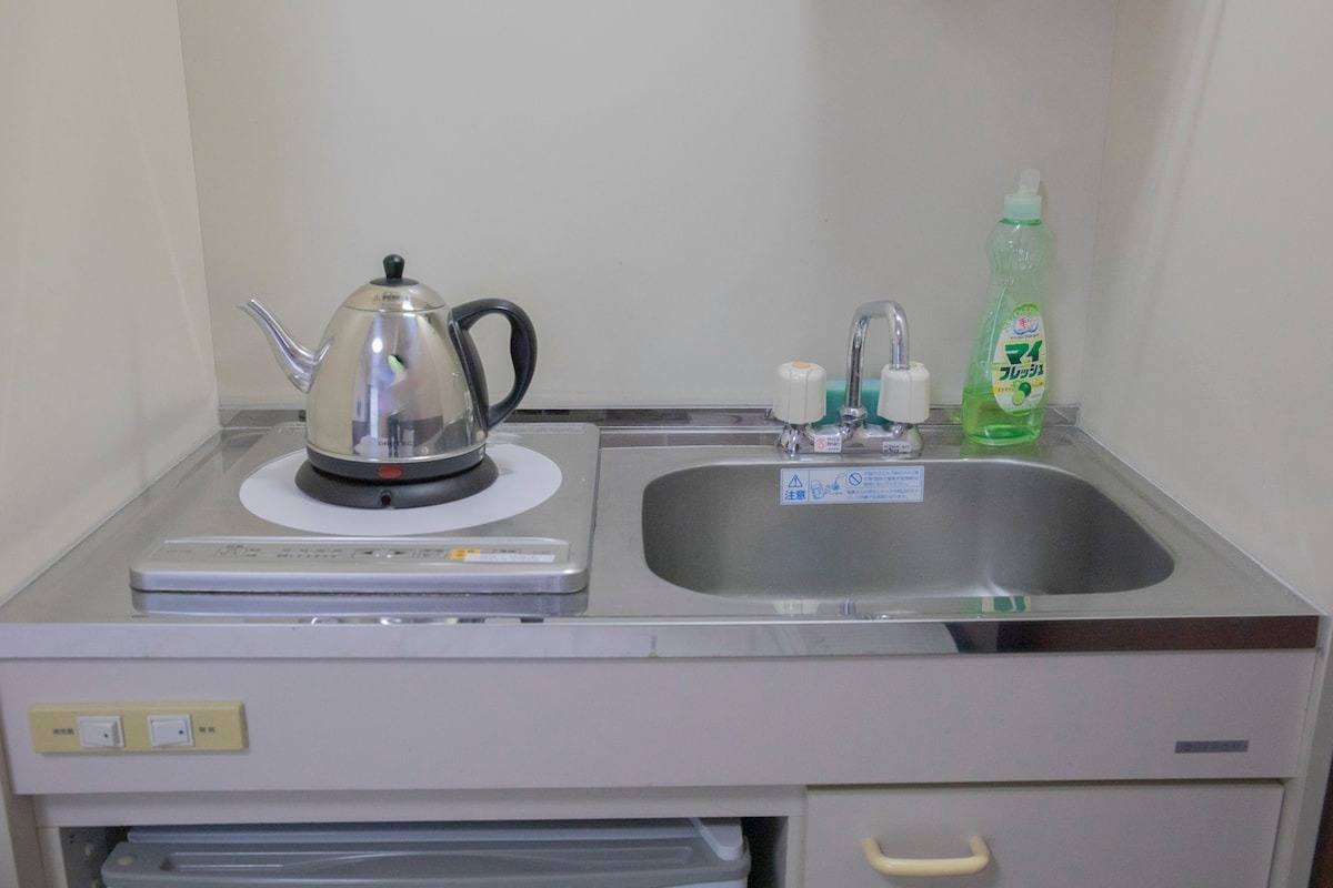 Kitchenette with kettle and sink