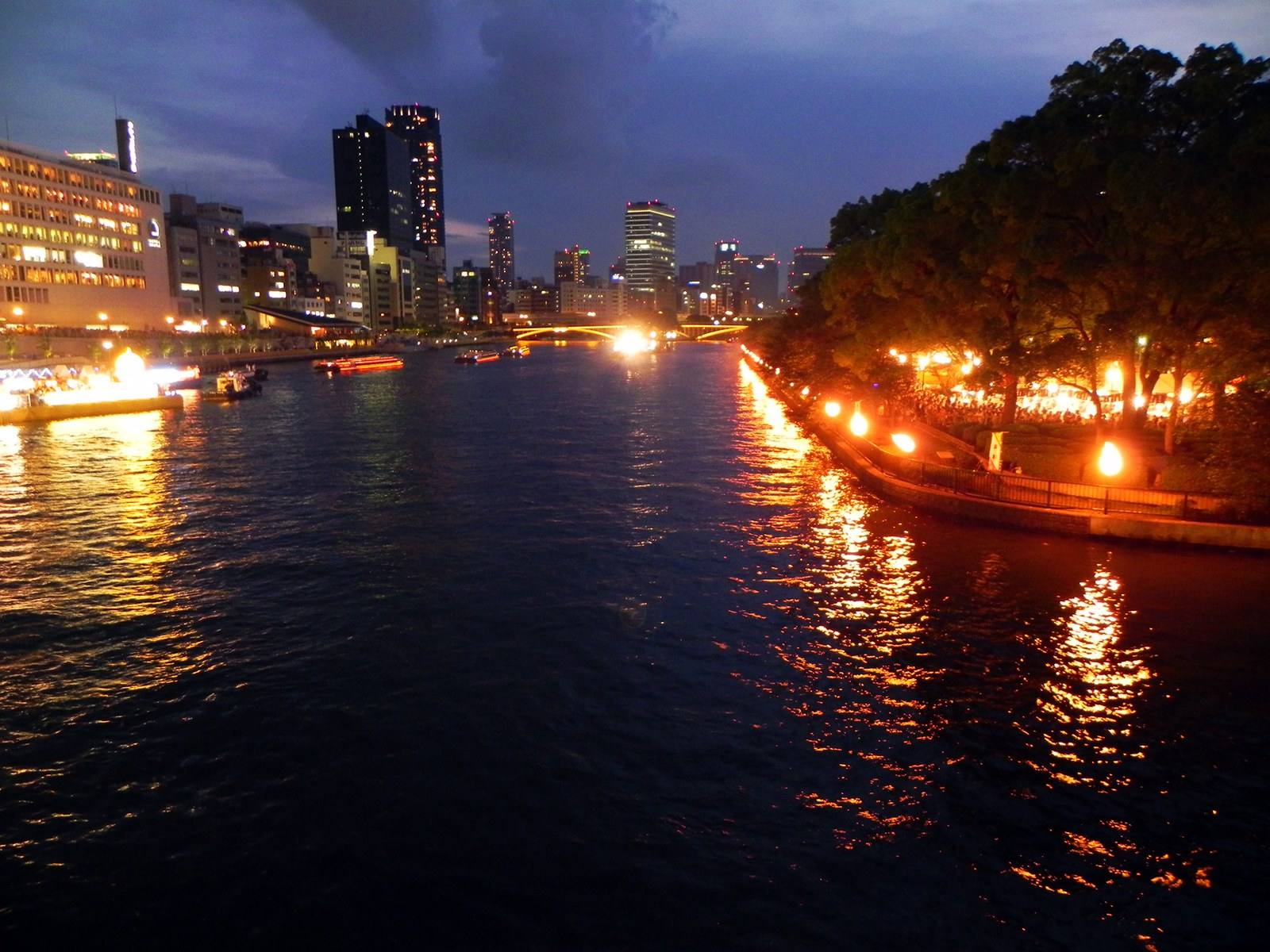 Lantern-lit boats on the Okawa River during Tenjin Matsuri