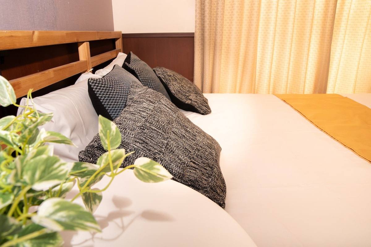 Corner of the bed by the window